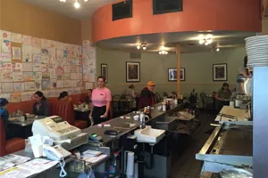Inside The Uptowner Café On Grand dining room with booths and counter